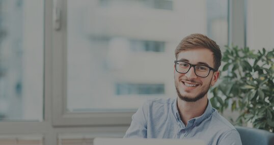 young business man smiles it jobs timetoact group