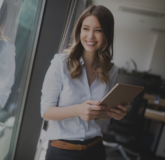 woman on window smiles it jobs timetoact group