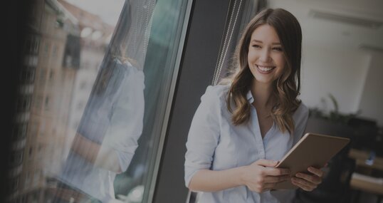 woman on window smiles it jobs timetoact group